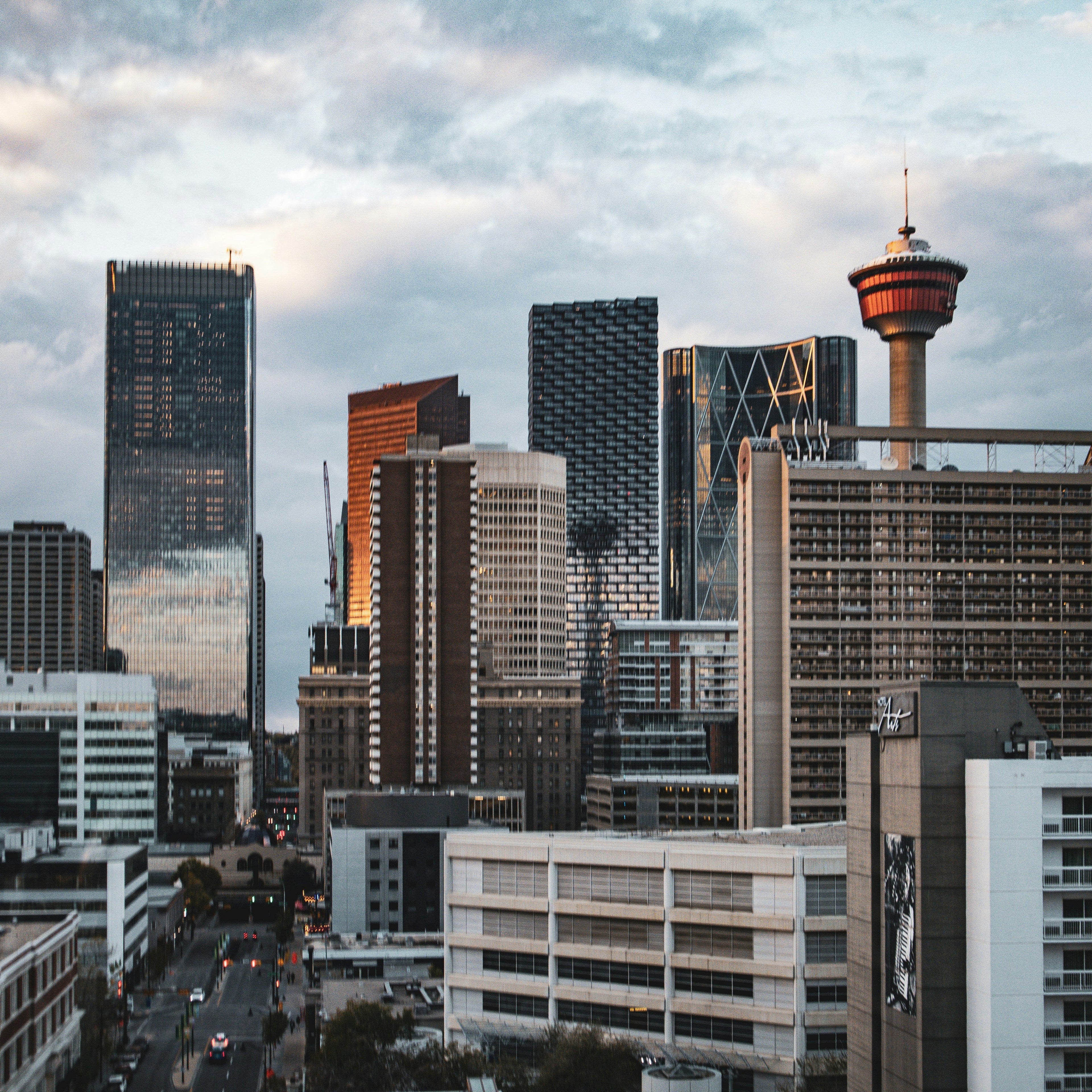City skyline with tall buildings under a cloudy sky